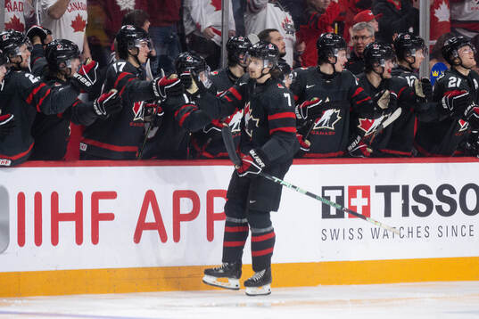 Brennan Othmann of Canada celebrates the 4-1 goal