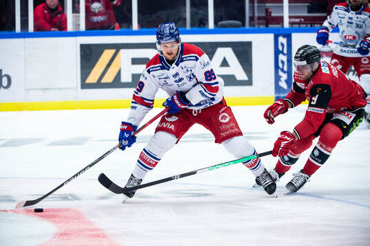 Oskarshamns Patrik Karlkvist och Malmö Redhawks Kim Rosdahl