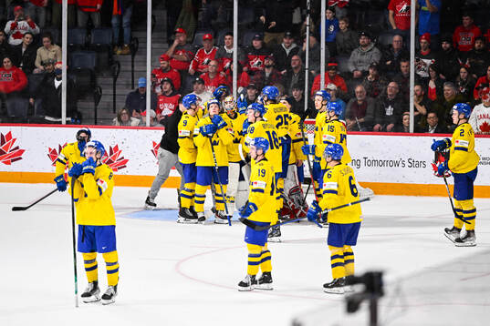 Players of Sweden look dejected