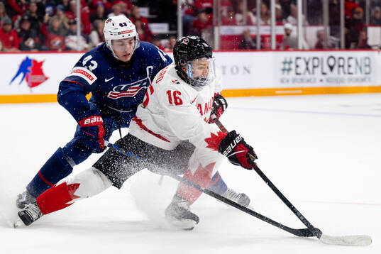 Connor Bedard of Canada and Luke Hughes of USA