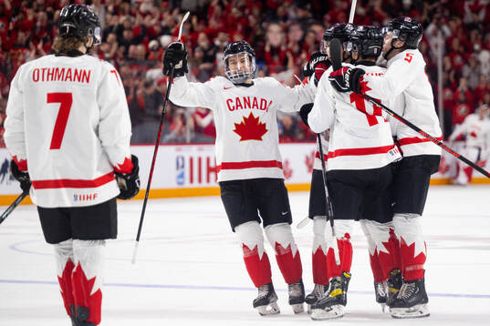 Connor Bedard of Canada celebrates the 0-1 goal by Dylan