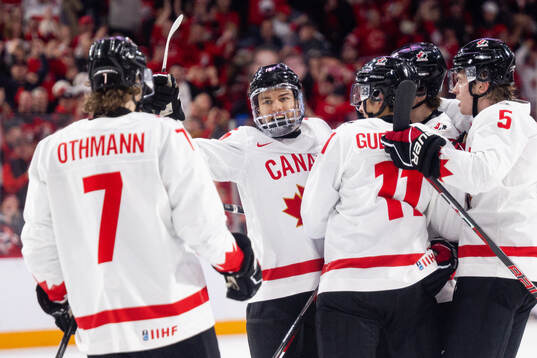 Connor Bedard of Canada celebrates the 0-1 goal by Dylan