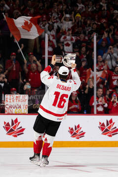 Connor Bedard of Canada celebrates