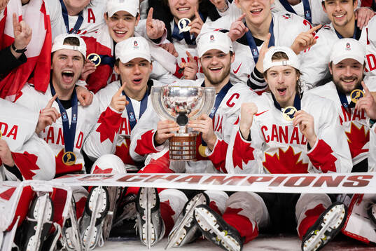 Connor Bedard and Shane Wright of Canada celebrate with the
