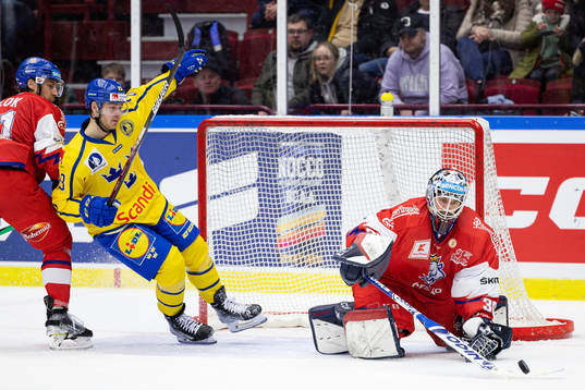 Lucas Wallmark of Sweden against goaltender Ales Stezka of