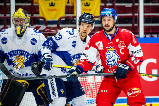 Julius Mattila and goaltender Juha Jatkola of Finland and