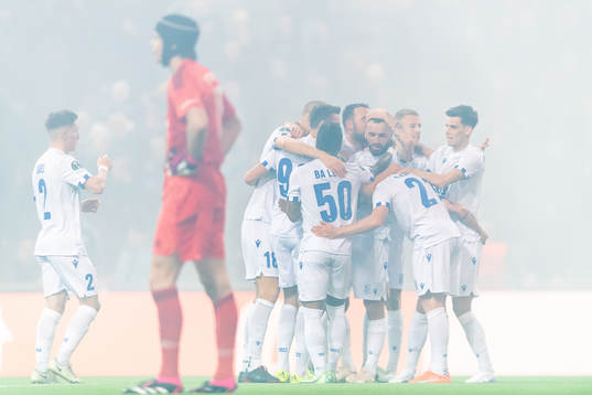 Players of Lech Poznan celebrate the 0-2 goal by Michal Skoras