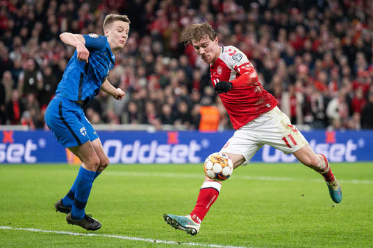 Rasmus Højlund of Denmark scores the 3-1 goal behind Robert Ivanov of Finland