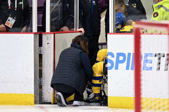 Paula Bergström of Sweden leaves the ice in a wheelchair
