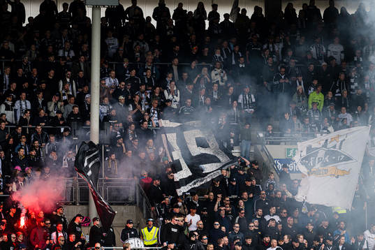 Spectators in the stands at Lerkendal Stadion ahead of the Eliteserien match between Rosenborg and Viking on April 10, 2023 in Trondheim.