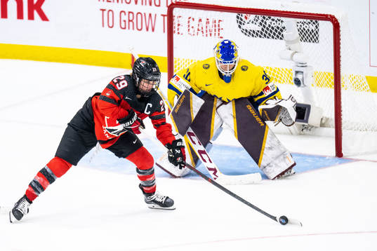 Marie-Philip Poulin of Canada and goaltender Emma