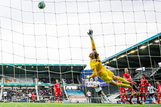 Milan Jevtovic of Odd missing a chance to score on goalkeeper Eirik Holmen Johansen of Brann