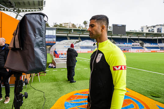 Mohammad Usman Aslam, referee, checking the VAR screen