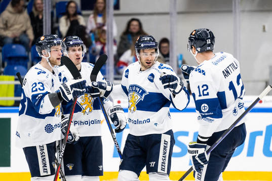 Ahti Oksanen celebrate with teammates Nikolas Matinpalo,