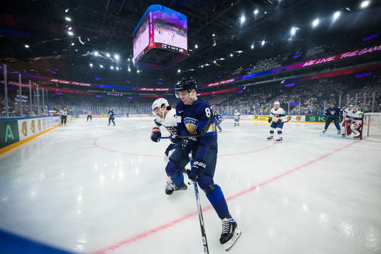 Michael Eyssimont of USA and Kaapo Kakko of Finland