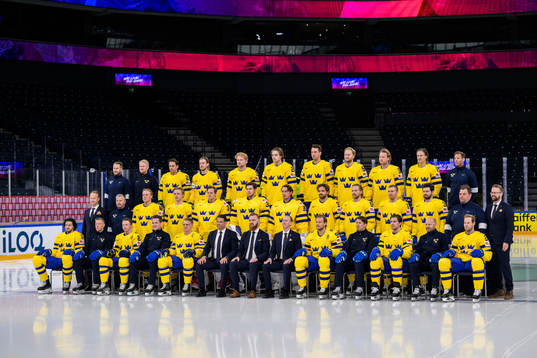 Players and team staff of Sweden pose for a team photo at a