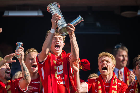 Niklas Jensen Wassberg of Brann celebrates with the trophy