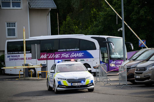 The team bus of Sweden arrives to the arena with a police