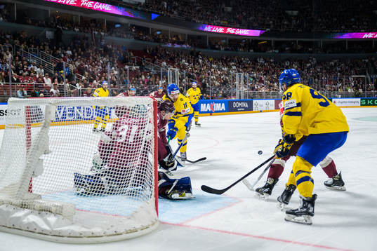 Dennis Everberg and Alexander Nylander of Sweden attack
