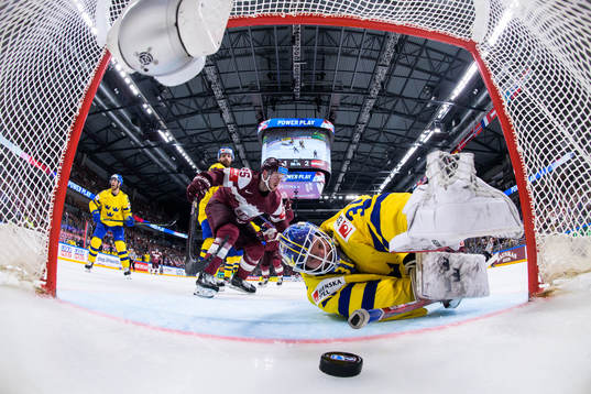 Oskars Batna of Latvia sees the 1-3 goal by Janis Jaks go