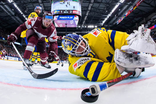 Oskars Batna of Latvia sees the 1-3 goal by Janis Jaks go