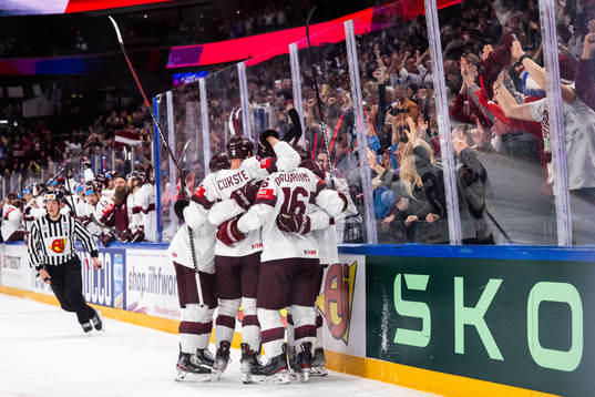 Rudolfs Balcers of Latvia celebrates with team mates