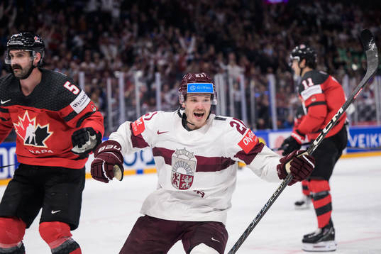 Rudolfs Balcers of Latvia celebrates scoring the 1-2 goal