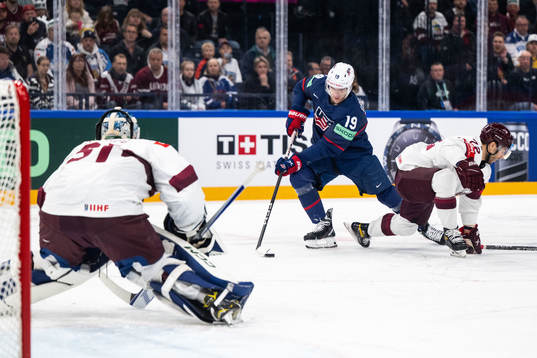 Goaltender Arturs Silovs and Janis Jaks of Latvia and