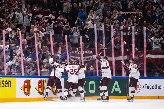 Janis Jaks of Latvia celebrates with teammates