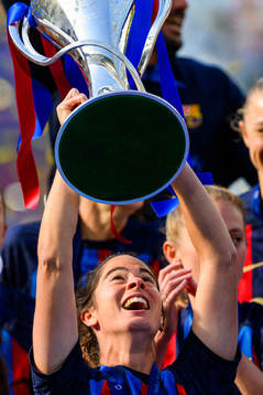 Marta Torrejon Moya of Barcelona lifts the trophy