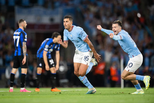 Rodri of Manchester City celebrates with Jack Grealish