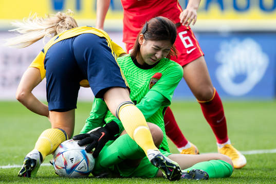 Agnes Nyberg of Sweden and goalkeeper Liu Chen of China