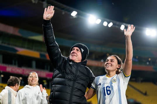 Head coach Alen Stajcic and Sofia Harrison of Philippines celebrate