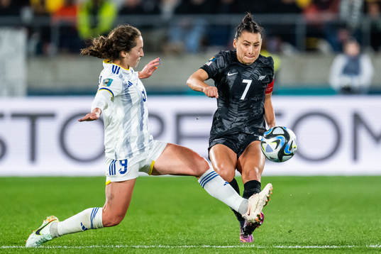 Isabella Flanigan of Philippines and Ali Riley of New Zealand