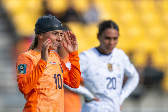 Danielle van de Donk of Netherlands with a rubber cap after receiving medical attention