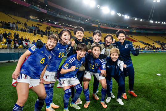 Hina Sugita, Miyabi Moriya, Aoba Fujino and Mina Tanaka of Japan celebrate