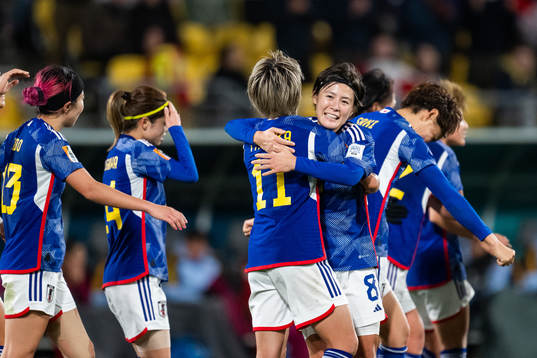 Mina Tanaka of Japan celebrates with Hikaru Naomoto