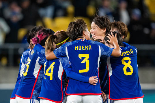 Mina Tanaka of Japan celebrates with team mates