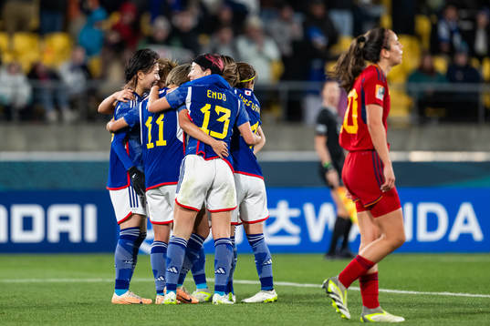Mina Tanaka of Japan celebrates with team mates