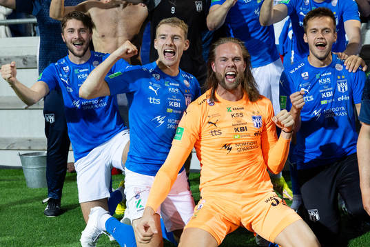 Goalkeeper Nils Jonatan Johansson of Klaksvik celebrates with team mates