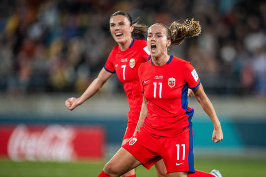 Ingrid Syrstad Engen and Guro Reiten of Norway celebrates after 1-1