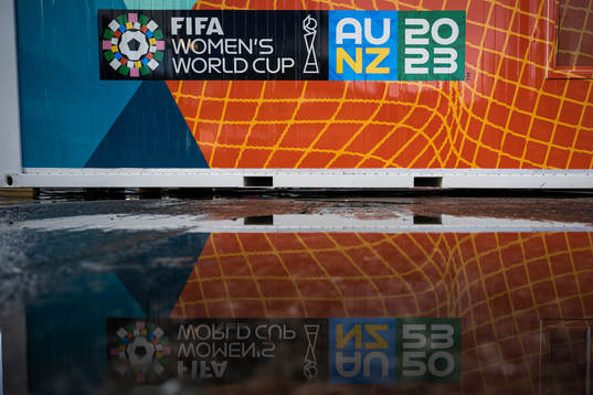 The logo for the FIFA Women's World Cup is reflected in water