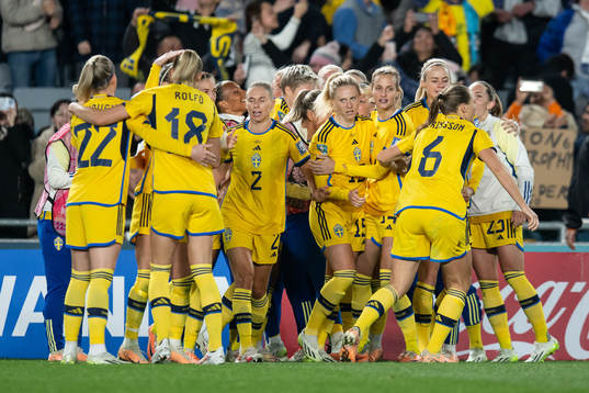 Players of Sweden celebrate after scoring 1-1