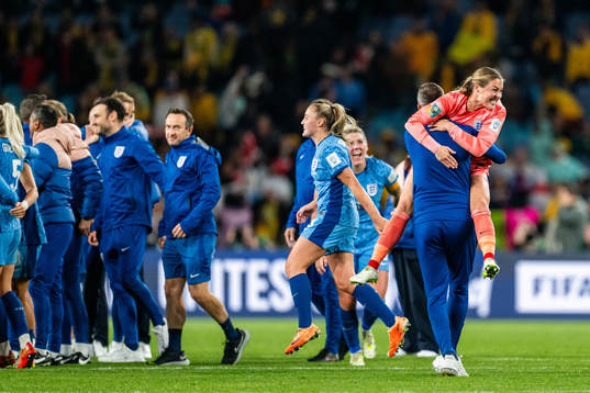 Goalkeeper Mary Earps celebrates with staff of England