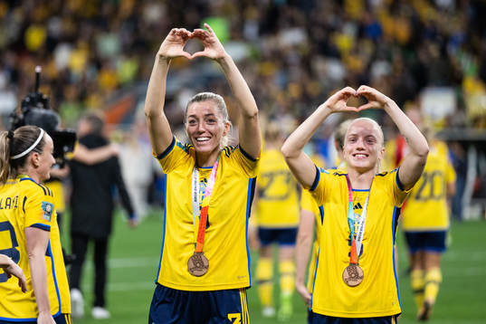 Linda Sembrant and Anna Sandberg of Sweden celebrate with their bronze medals