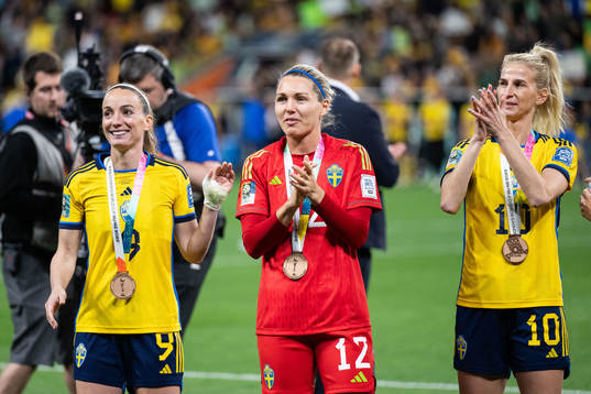 Kosovare Asllani, goalkeeper Jennifer Falk and Sofia Jakobsson  of Sweden celebrate with their bronze medals