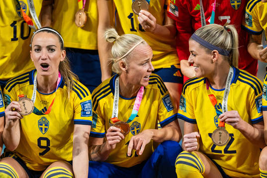 Kosovare Asllani, Caroline Seger and Olivia Schough of Sweden celebrate with their medals at the award ceremony