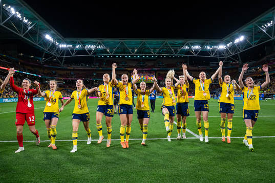 Players of Sweden celebrate with their medals