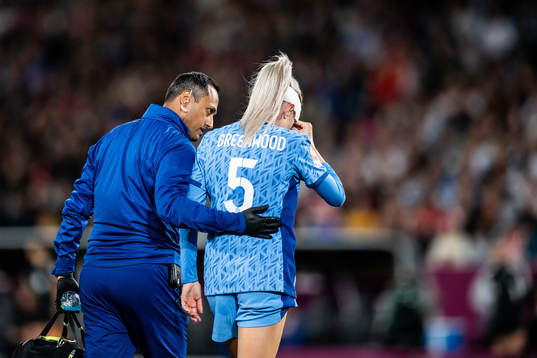 Alex Greenwood of England receives medical attention
