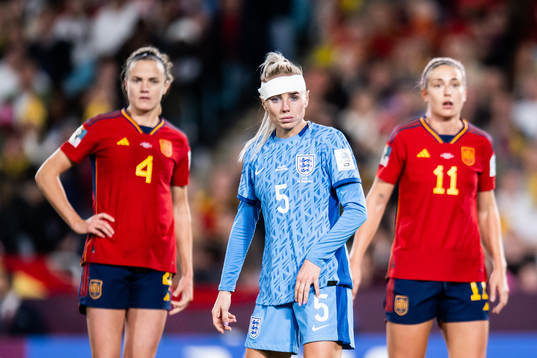 Irene Paredes and Alexia Putellas of Spain and Alex Greenwood of England
